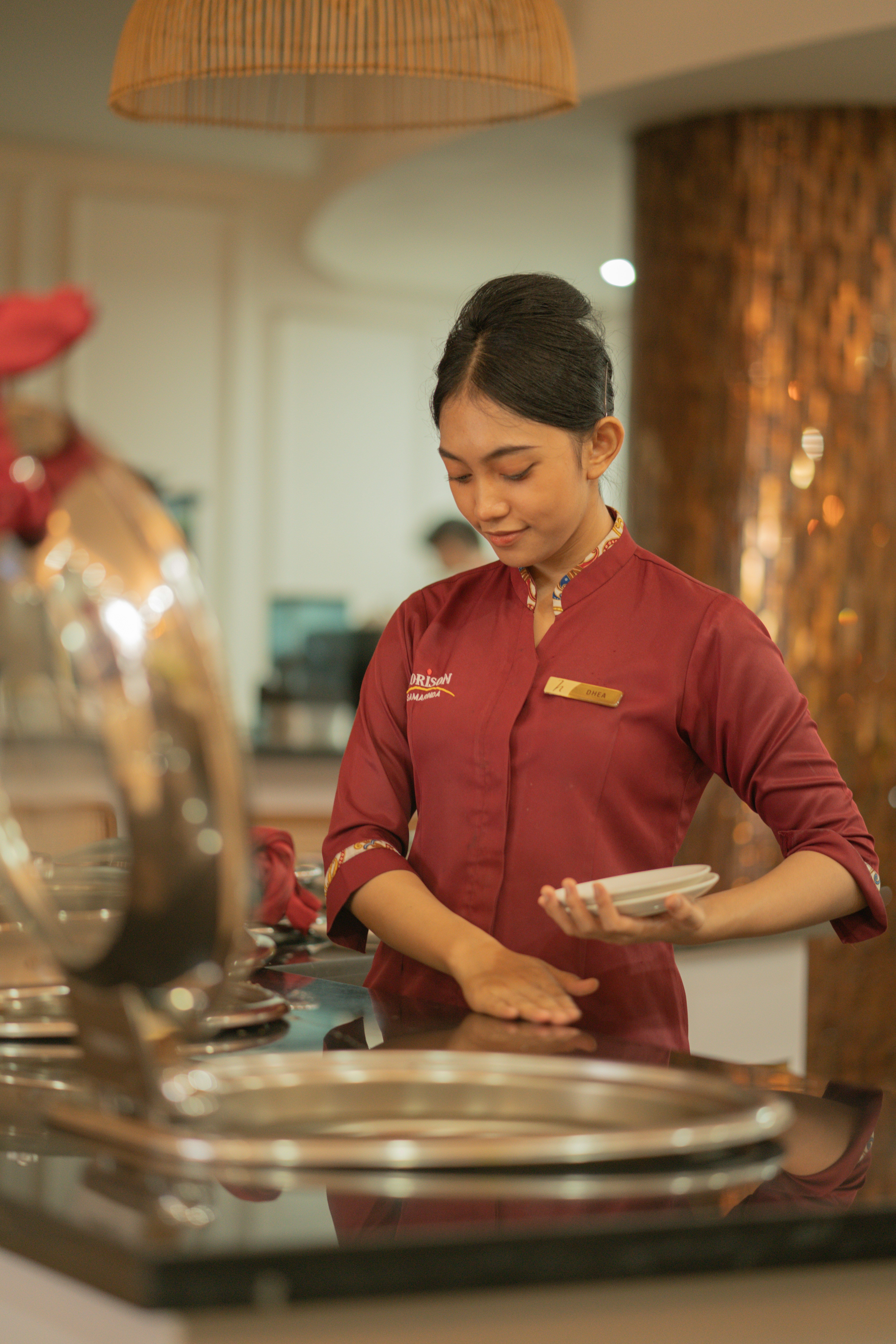 An Antagon-placed hospitality worker setting up service at a hotel